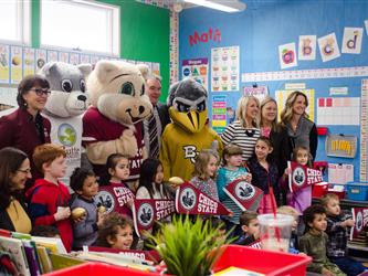 Photo of college mascots with students